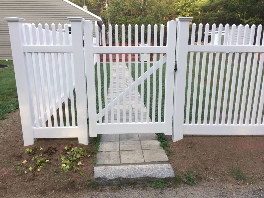 White picket fence gate to the entrance of the yard