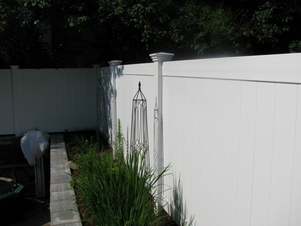 White privacy fence in a yard
