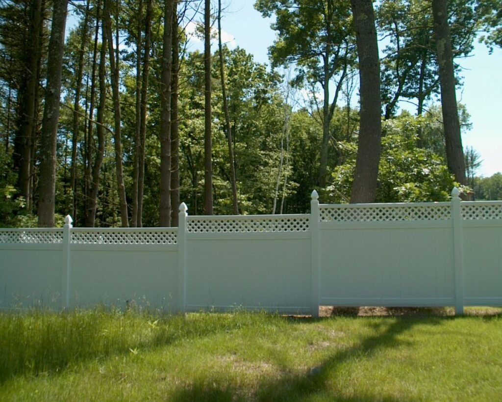 White vinyl privacy fence with a top lattice