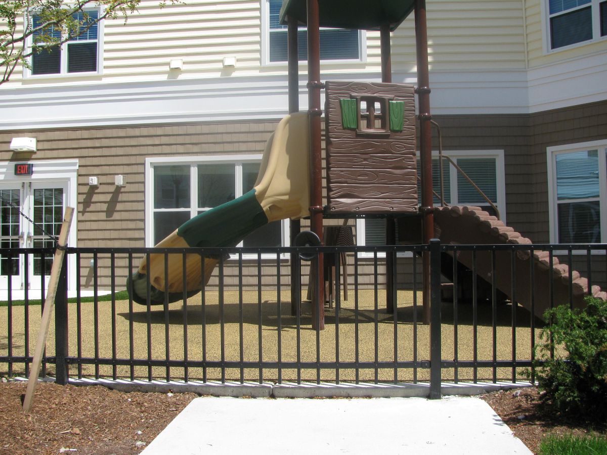Commercial fencing service for a little apartment playground.