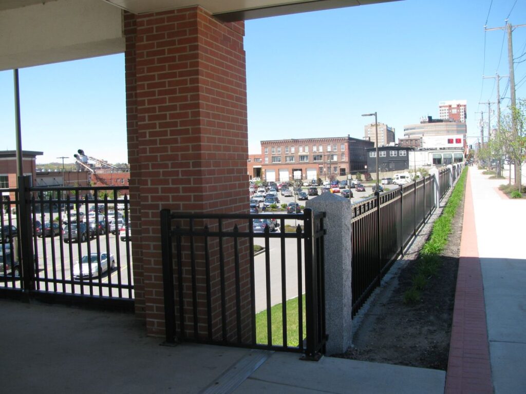 Metal fence close to parking lot