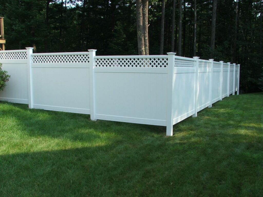 A white vinyl lattice fence