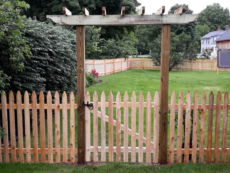 Entry pergola with picket fence