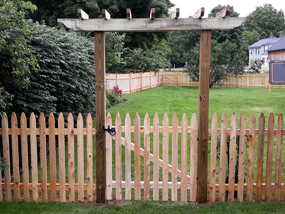 Entry pergola with picket fence