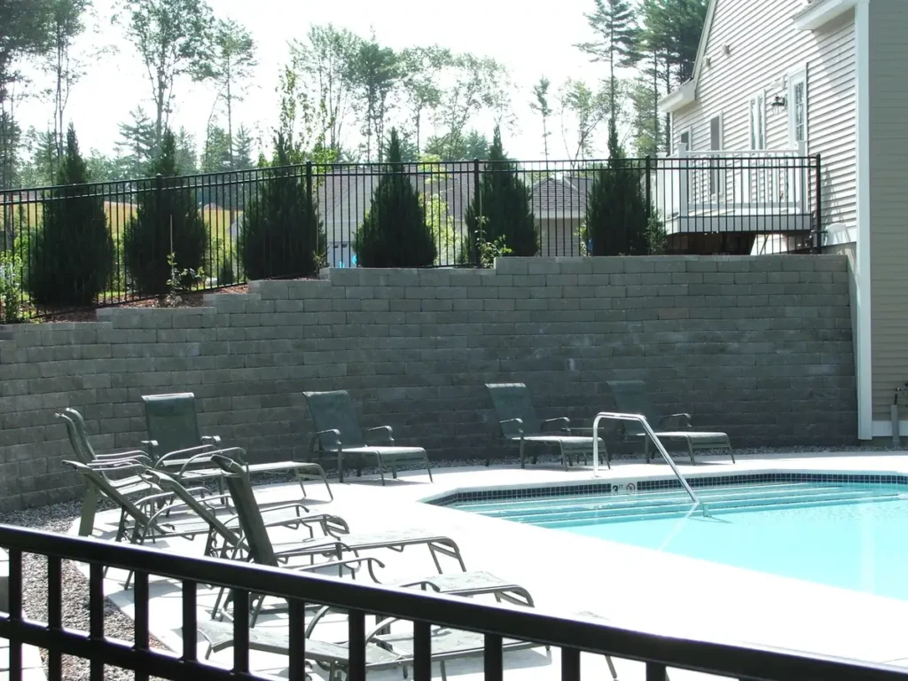 black ornamental aluminum fence around a pool
