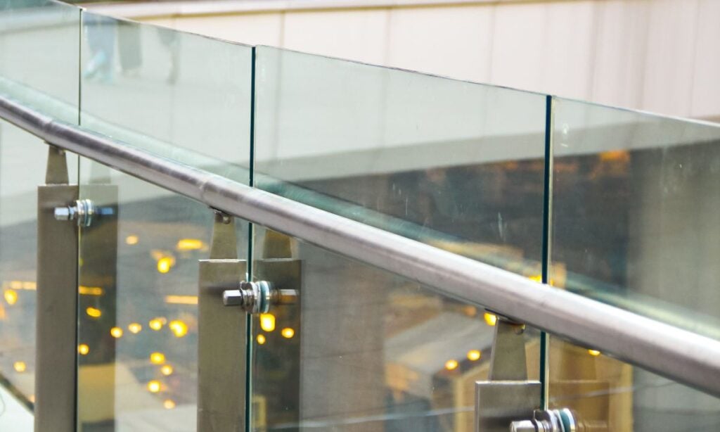 Matte aluminum railing with glass panels