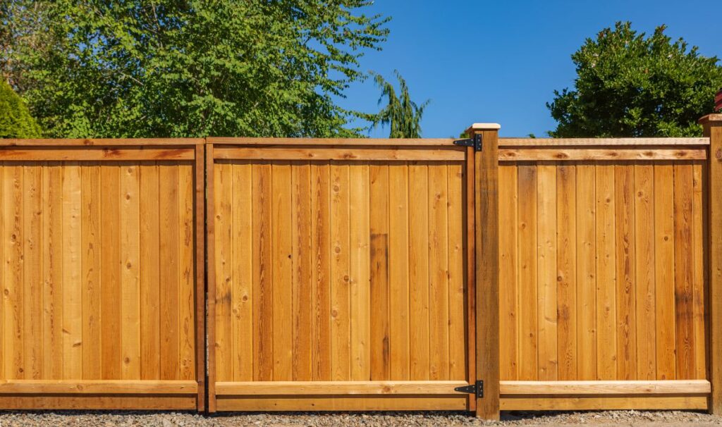 Nice new wooden fence around house