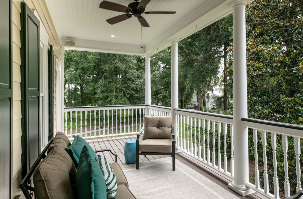 Beautiful porch with furniture and white railing. Front Porch Railing Ideas to Upgrade Your Home