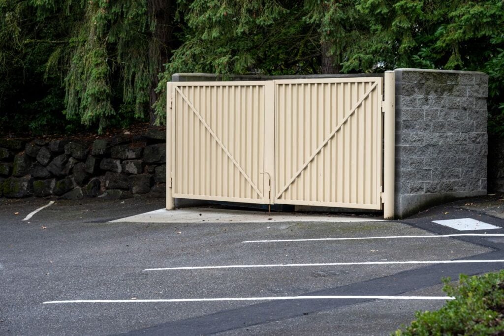 Commercial property parking lot with garbage dumpster enclosure