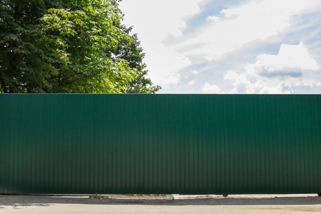 Green tin fence metal Sheets around the house or garden
