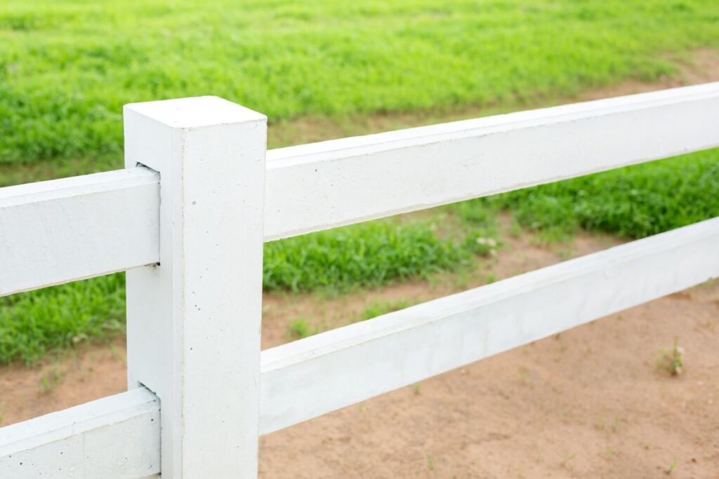 White fence in farm field