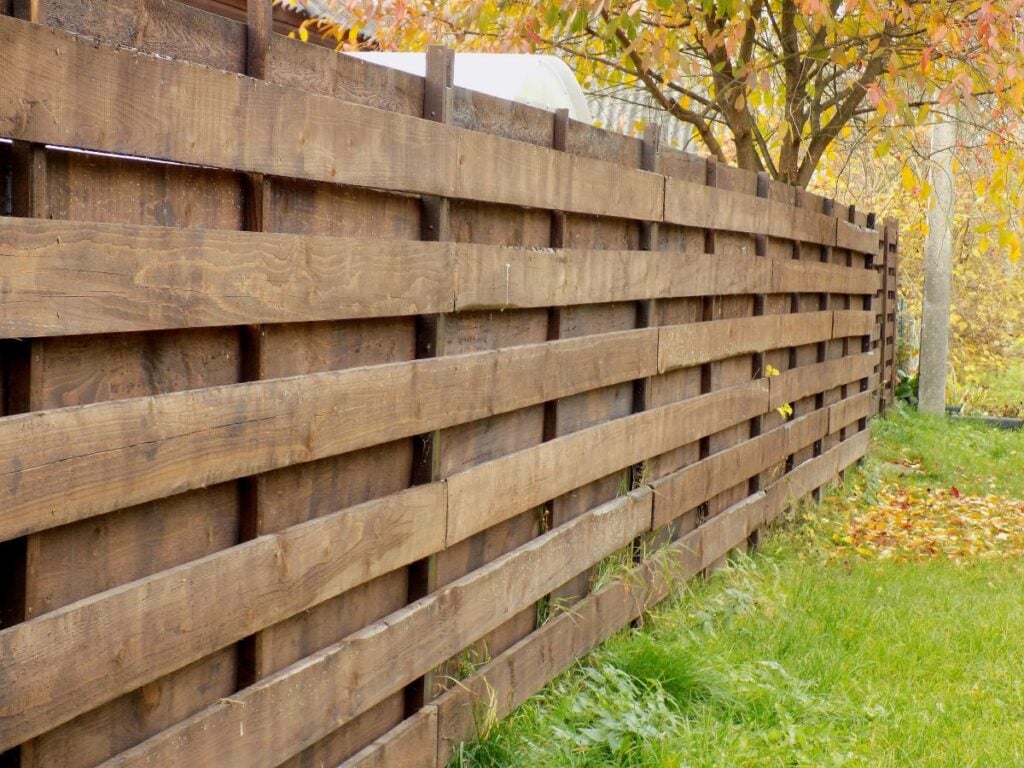 Wooden fence made of brown horizontal planks